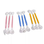 Three sets of plastic sculpting tools with white silicone heads, featuring pink, blue, and yellow handles on a plain white background.